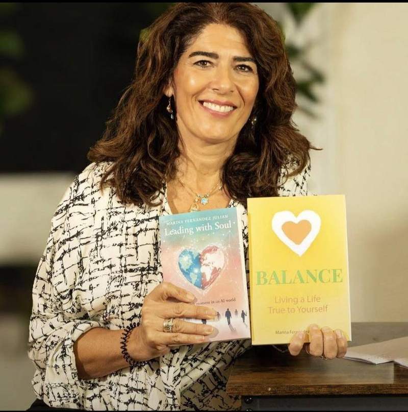 Marina holding her books, Balance and Leading with Soul