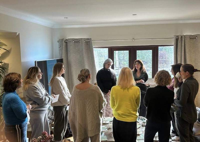 A small group gathered for a workshop in Marina's living room